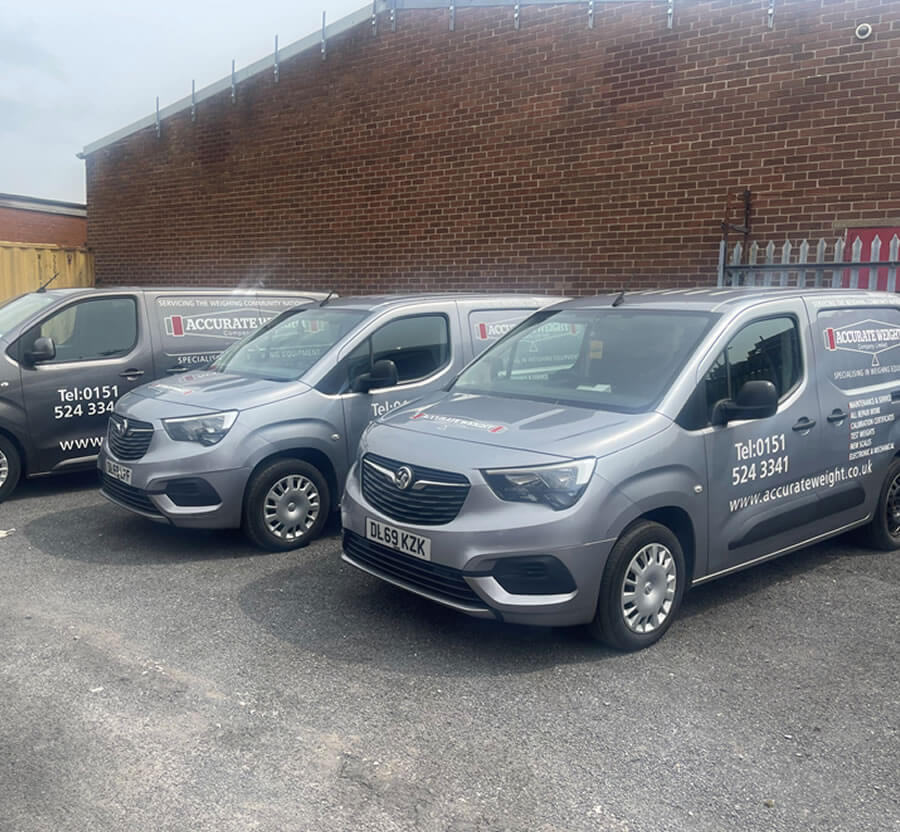 Accurate Weight service vans used for on-site scale calibration and repair services.